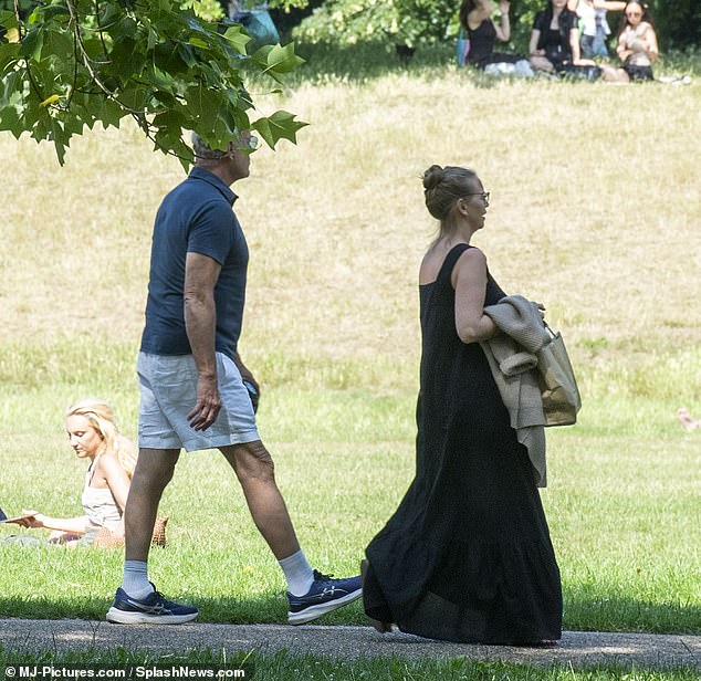 The couple enjoyed some fresh air strolling through the park