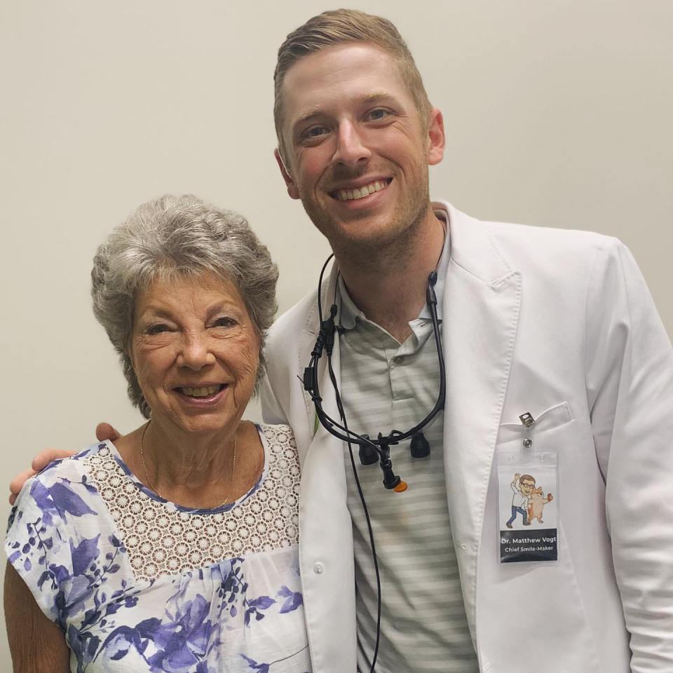 Photo of a dentist and a patient.