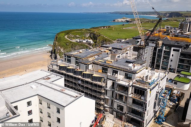 Families living in the Cliff Edge development in Newquay, Cornwall, pictured, have been left 'scared their homes could collapse'