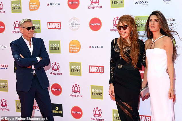 George Clooney proved he is ever the gentleman as he let his glamorous wife Amal take centre stage on the red carpet at the King's Trust Awards in London on Thursday; pictured with Charlotte Tilbury who is an ambassador for the King’s Trust