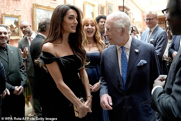 There, among the VIPs invited were Hollywood A-listers George and Amal Clooney, who looked to be in good spirits as they chatted with other attendees
