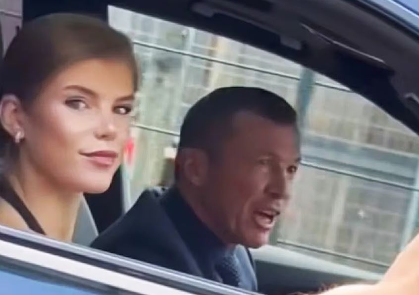 Lothar Matthäus and a young woman in a car.