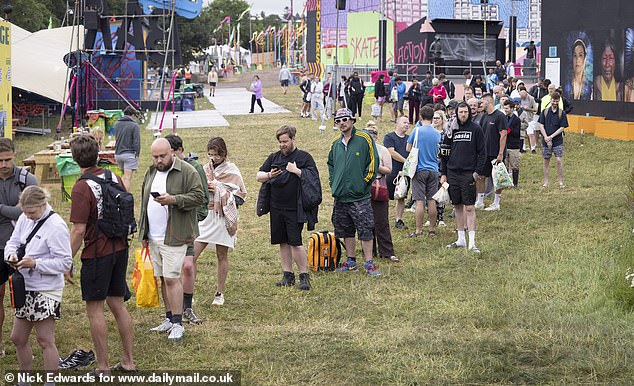 Long queues for the showers at Glastonbury Festival at Worthy Farm in Somerset this morning
