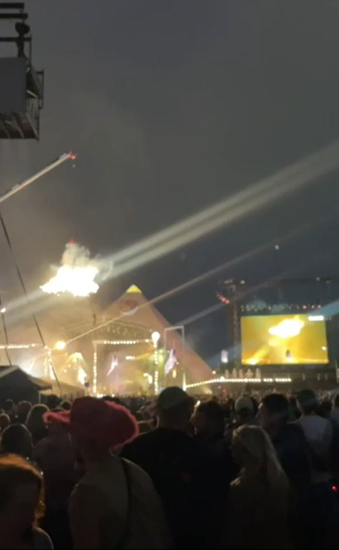 Concert pyrotechnics over a large crowd.
