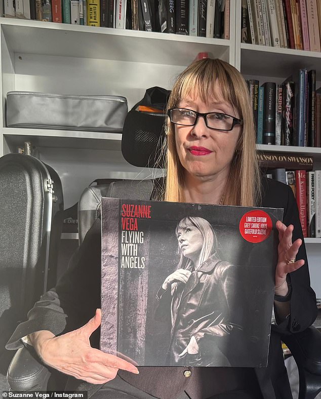In photos shared to her Instagram, Suzanne looks almost unrecognisable, with her long blonde hair and smart style as she poses with her record Flying With Angels