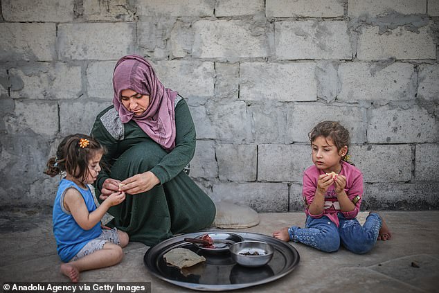Edinburgh University were given £123,000 to record 'harvesting songs of displaced Syrian refugees living in Middle Eastern countries'. Pictured: Syrian refugees are seen at the refugee camp in Idlib