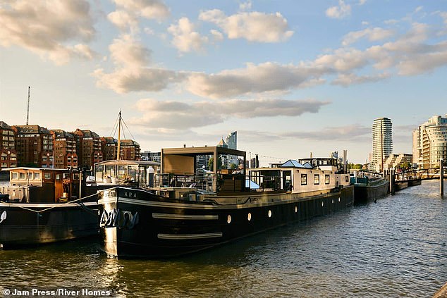 The barge is moored on a long-term residential berth at St Mary's Wandsworth Pier in southwest London