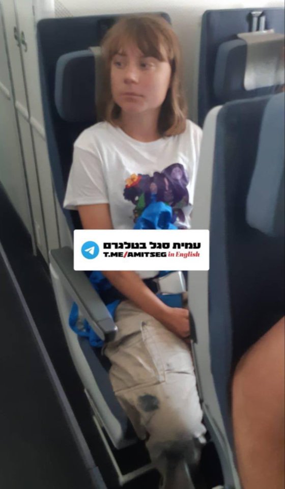 Greta Thunberg being deported from Israel on a plane.