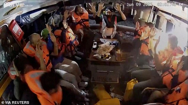 A surveillance footage shows crew of the Gaza-bound British-flagged yacht 'Madleen', put their hands up as they are intercepted by Israeli boats early Monday morning