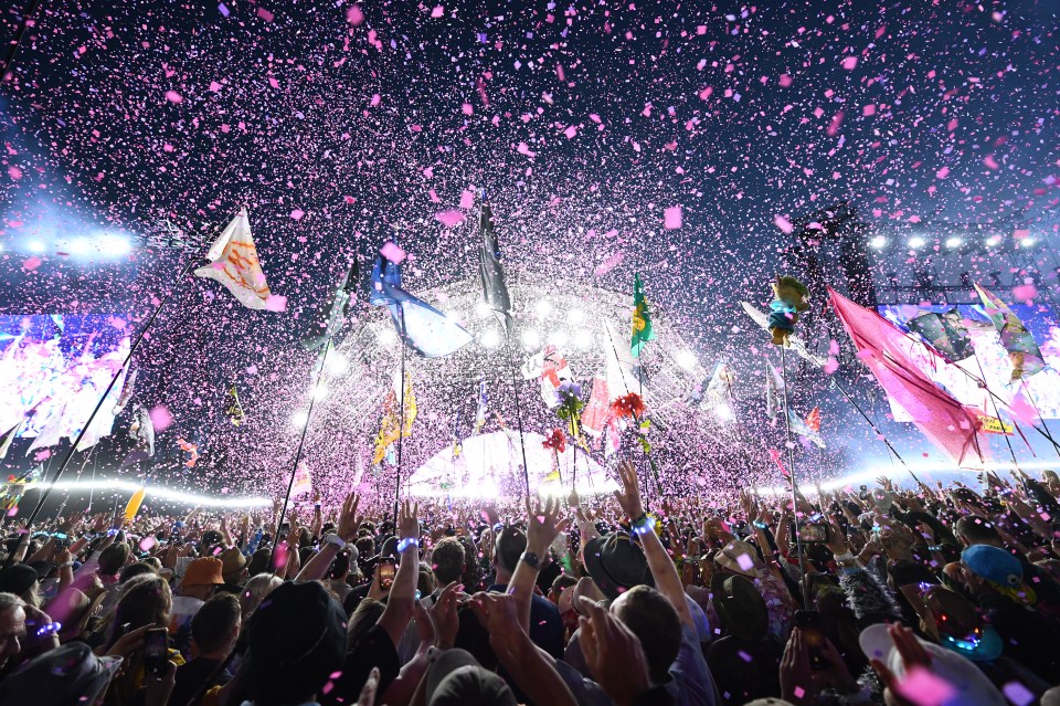Glastonbury Festival crowd at the Pyramid Stage during a performance.