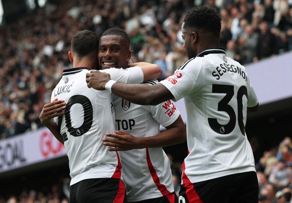 Fulham's Alex Iwobi celebrates a goal with teammates.