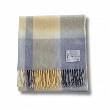 Yellow and grey plaid throw blanket.