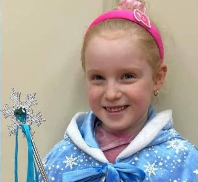 Casey Wilson, five, (pictured) was happily riding her scooter along the pavement near her school with her brother and mum when an 'out of control' car collided into her