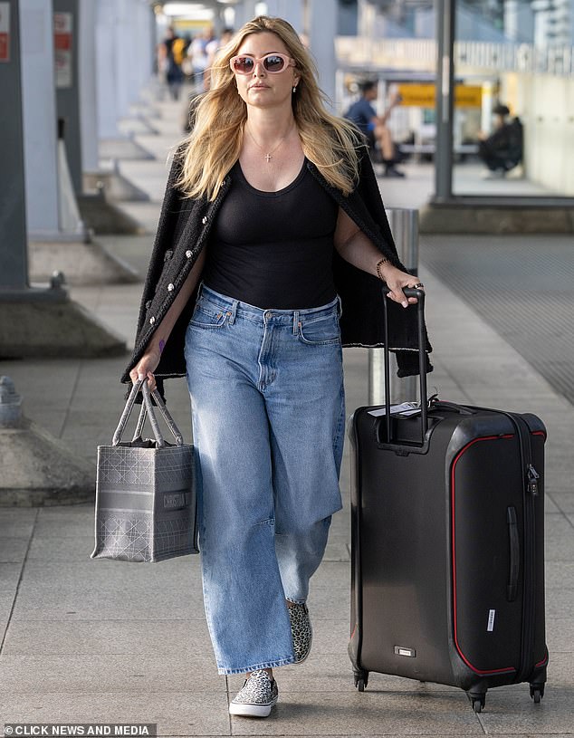Holly Valance has been pictured not wearing her wedding ring after her marriage split from businessman husband Nick Candy