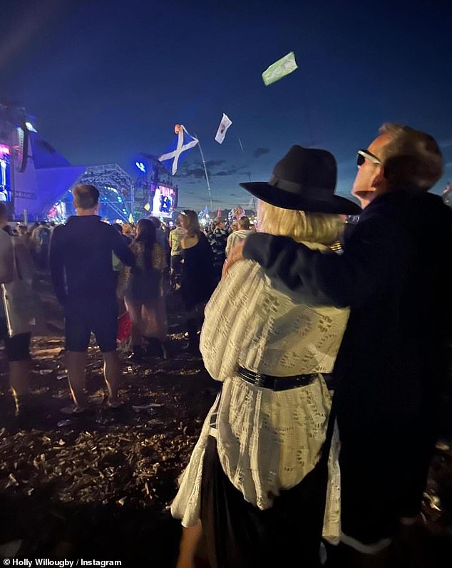 Earlier this year, Holly gave an insight into her past years at Glastonbury as she revealed she spent one night scrubbing a toilet at the festival (pictured with husband Dan)