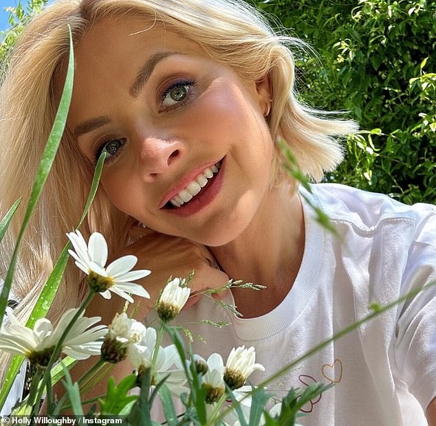 Holly Willoughby shared a sweet snap of her dad Brian sitting in the I'm A Celebrity jungle as she led the stars celebrating Father's Day on Sunday