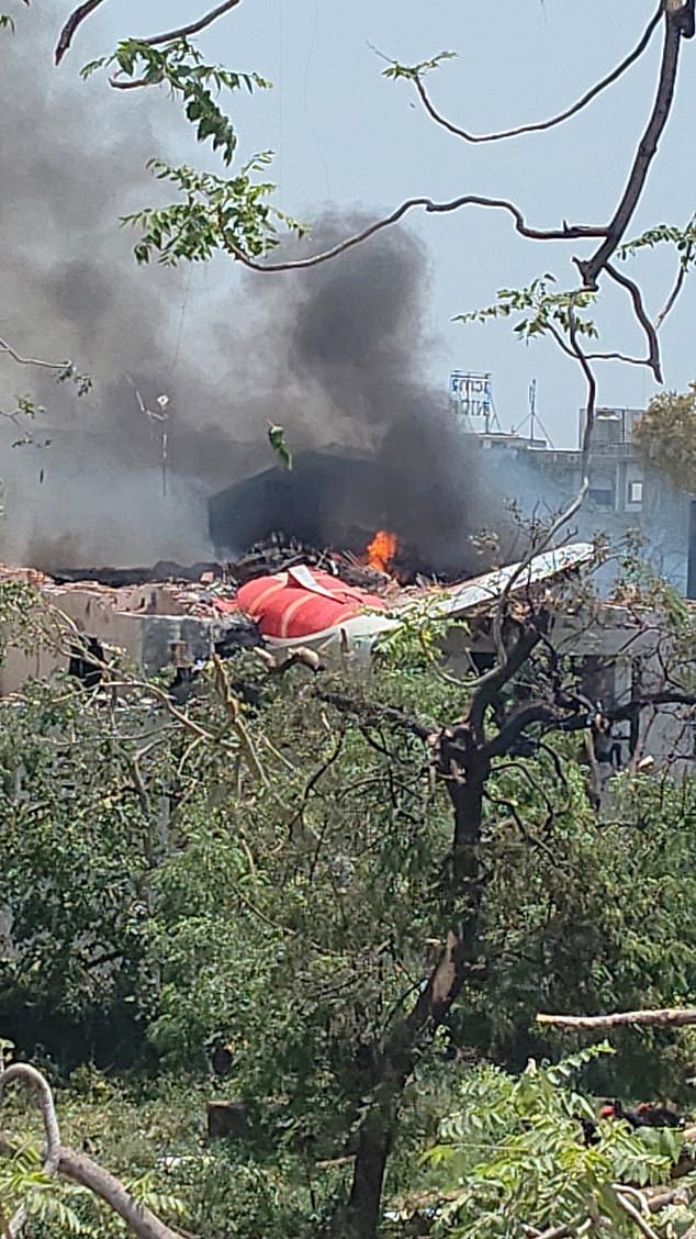 Chunks of the plane's fuselage and tail were seen protruding from a demolished building
