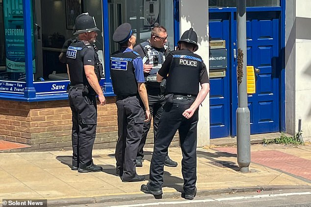 Police have been ridiculed for sending a team of officers to deal with a swarm of bees that had landed on a traffic light pole