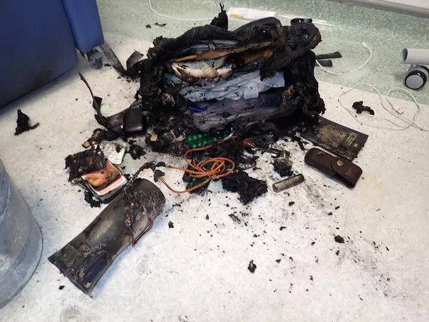 Fire damage to a bag and its contents.