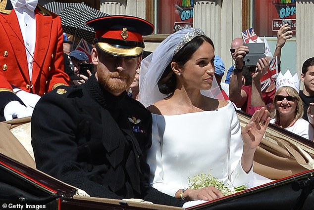 Prince Harry, Duke of Sussex and his wife Meghan, Duchess of Sussex, after their wedding St George's Chapel, Windsor Castle, in Windsor, on May 19, 2018. A royal expert has written claims that they had upset the Queen