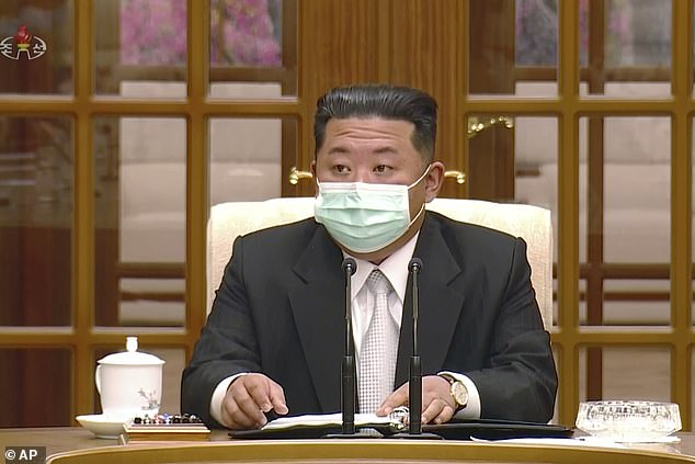 In this image made from video broadcasted by North Korea's KRT, North Korean leader Kim Jong Un wears a face mask on state television during a meeting acknowledging the country's first case of COVID-19 Thursday, May 12, 2022, in Pyongyang