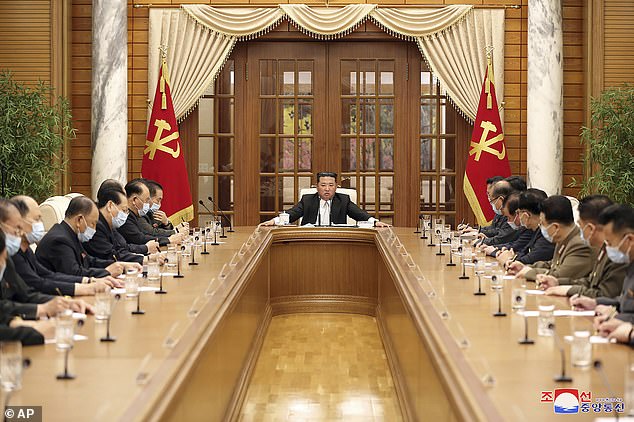 Kim Jong Un, center, attends a meeting of the Central Committee of the ruling Workers' Party in Pyongyang, North Korea Thursday, May 12, 2022