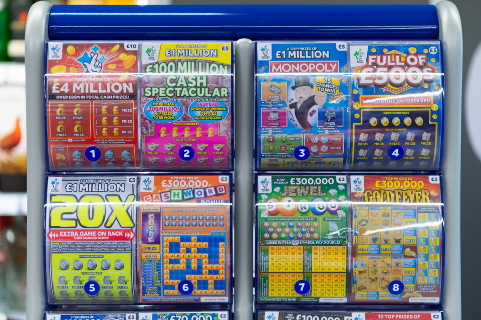 National Lottery scratchcards displayed in a newsagent.