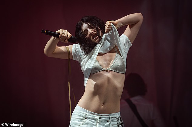 Lorde sent fans into a frenzy with a surprise performance at Glastonbury which saw her whip her top off in the sweltering heat