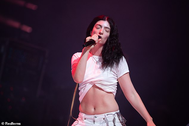 Music icon Lorde, 28, has reportedly gone public with her new romance with music record producer Jim E-Stack as they partied at Glastonbury (pictured on Friday at Glastonbury)
