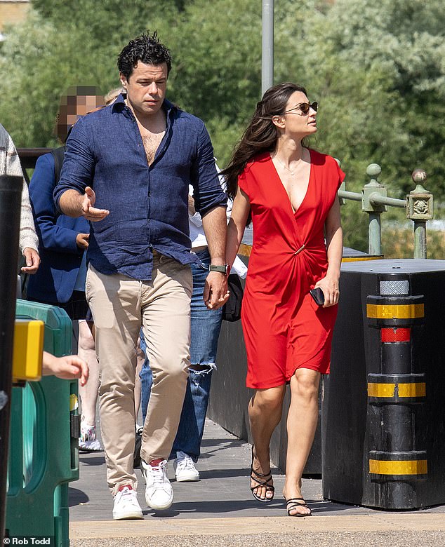 Sebastien Bowen, 45, walks towards Barnes with a beautiful 'mystery' woman