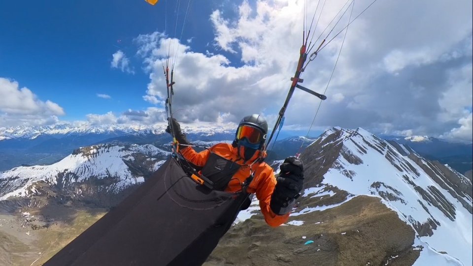 A paraglider in the French Alps during a storm.