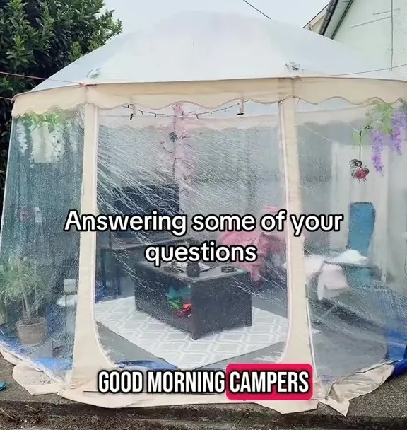 Pop-up gazebo with furniture inside.