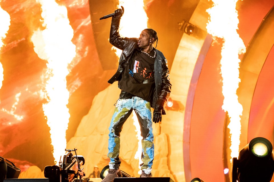 Travis Scott performing at a music festival.