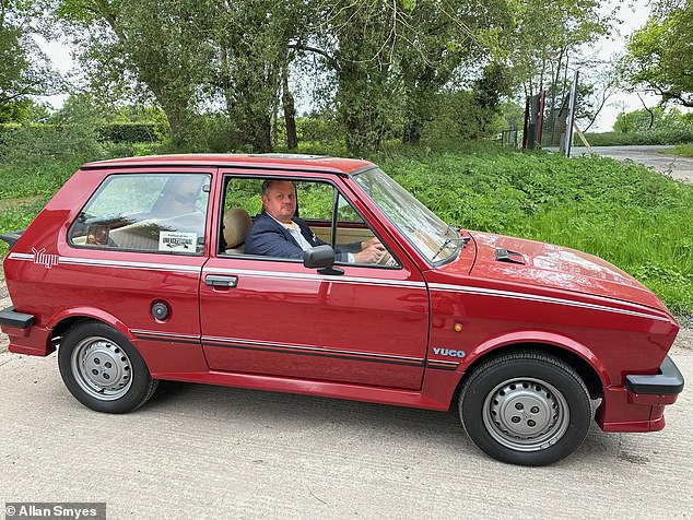 'It's not the worst car in history!' Allan Smyes, 50, pictured in his 1988 Zastava Yugo 45 - one of just two examples that survive today in the UK