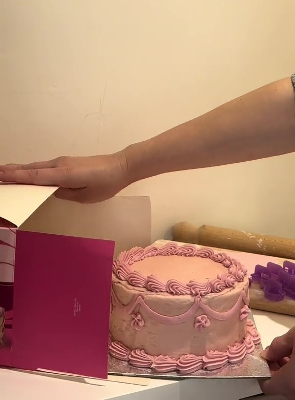 Homemade pink birthday cake costing £18.