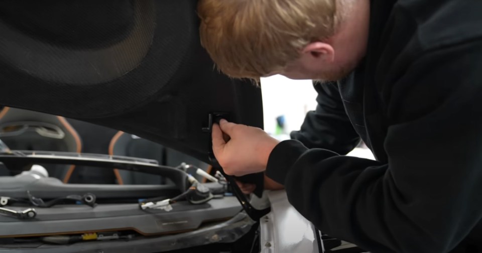 Person working on a McLaren.