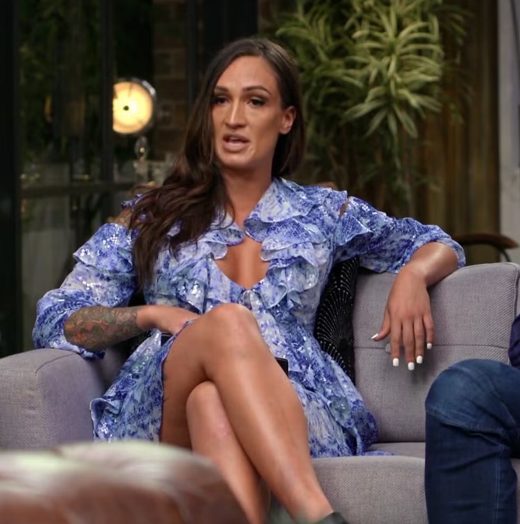 Hayley Vernon, seated on a couch, discussing her experience leaving OnlyFans after finding God.