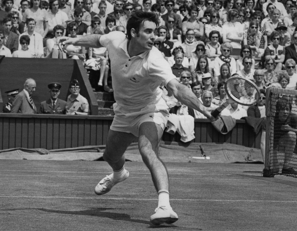 Black and white photo of Roger Taylor playing tennis at Wimbledon in 1971.