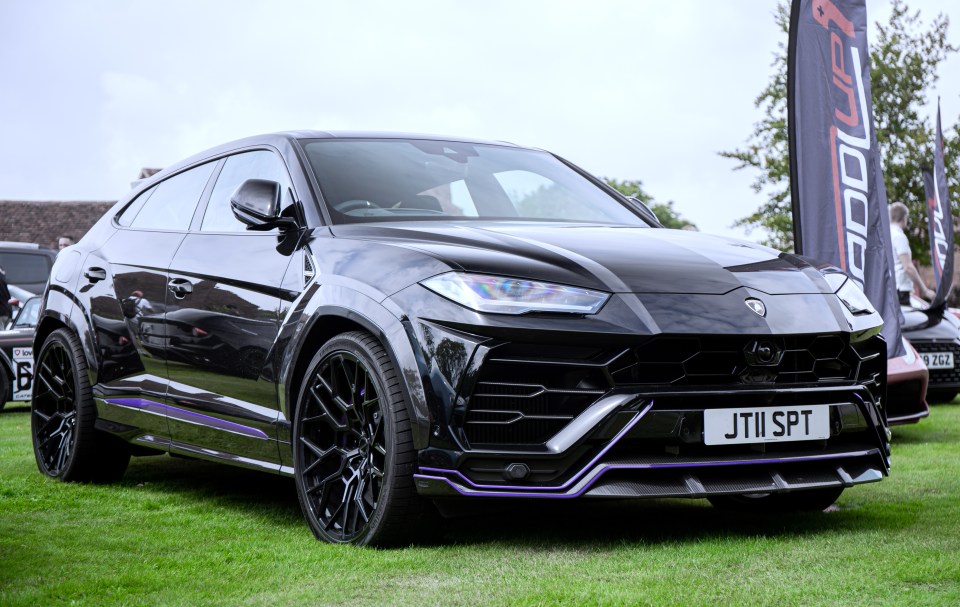 Black Lamborghini Urus with marble wrap.