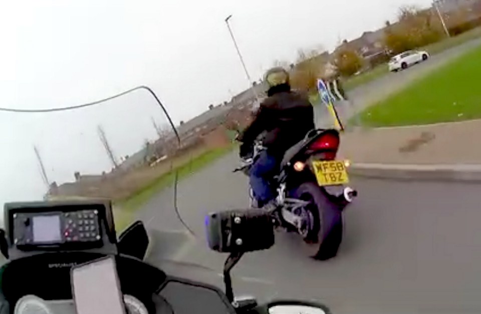 Police chasing a motorcyclist.