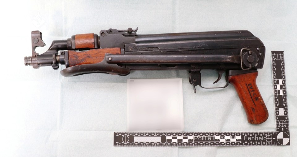 Seized firearm with scale.