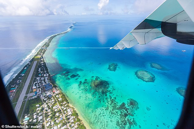 Paradise soon to be lost? Tuvalu is located 1,000km north of Fiji in the west-central Pacific Ocean... but could disappear within 50 years because of global warming, say experts