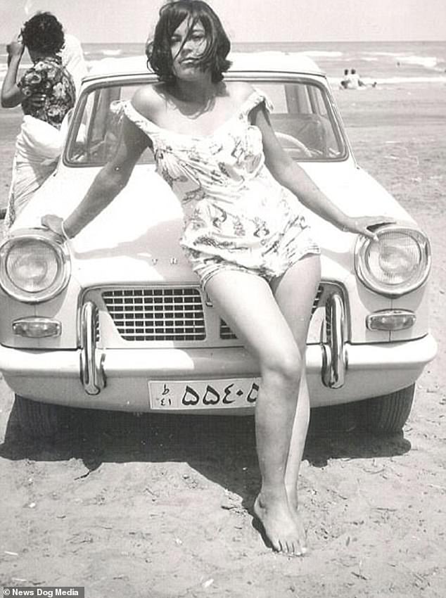 Under the rule of King Shah Mohammad Reza Pahlavi, who was an ally of Britain and the U.S., the hijab was even banned because it was argued it suppressed women. Above: An Iranian woman poses in a swimsuit at the beach in Iran