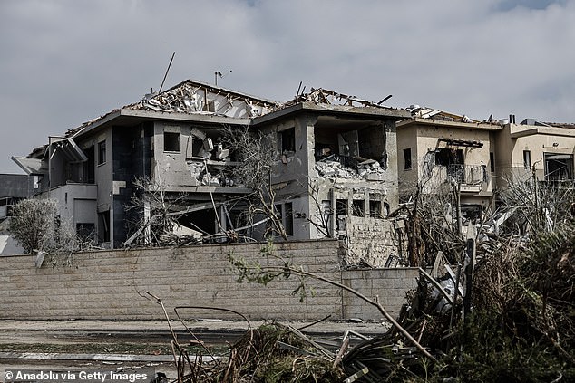 A view shows damage to buildings and vehicles after a missile fired by Iran, in retaliation for Israeli attacks, struck the city of Ness Ziona, near Tel Aviv