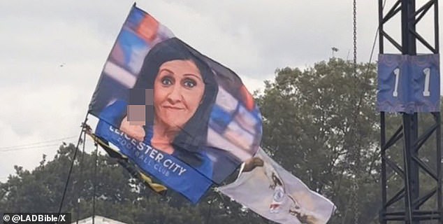 A flag depicting the moment BBC News presenter Maryam Moshiri gave the middle finger to the camera live on air appeared at Glastonbury last year