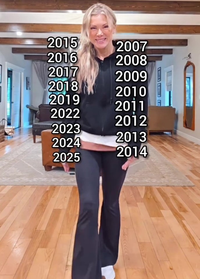 Woman standing in her living room with years she's been pregnant listed.