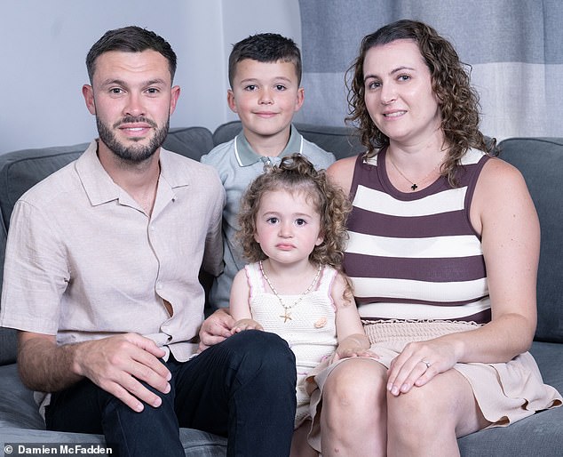 Support: Ryan Woolley, who ran the London Marathon last year, with his family