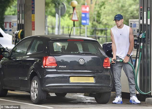 These exclusive pictures show the 23-year-old still driving around in a battered VW Polo