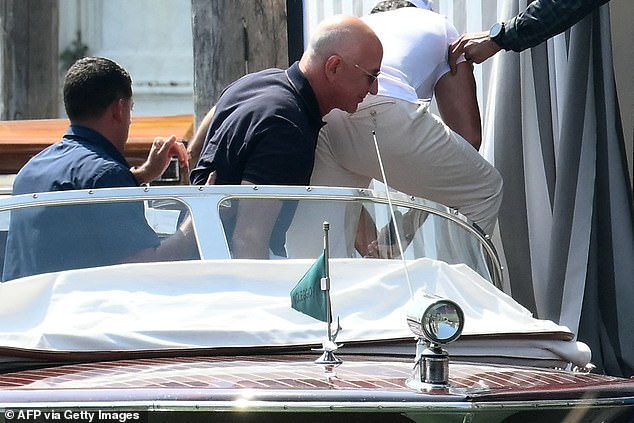 Amazon's founder Jeff Bezos (C) arrives at the Aman Hotel in Venice