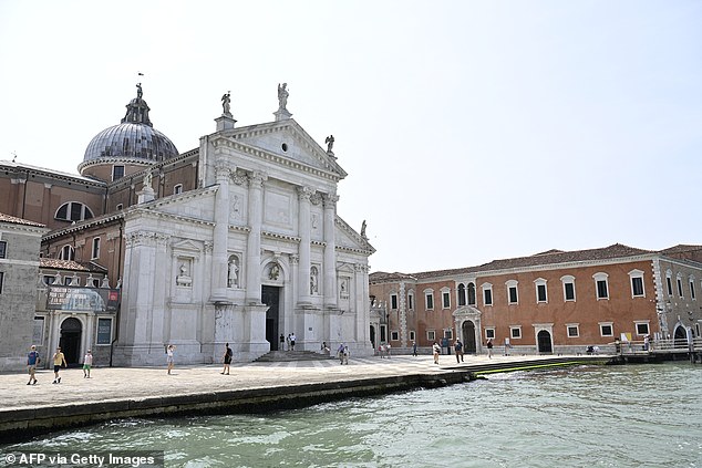 The couple will say 'I do' on the island of San Giorgio, (pictured) which is home to the famous Basilica of San Giorgio Maggiore, a 16th century Benedictine church